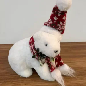 Urso sentado branco com gorro vermelho