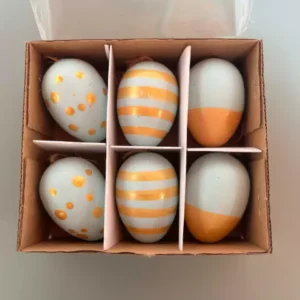 Pendente ovo cx com 6 unid dourado e azul