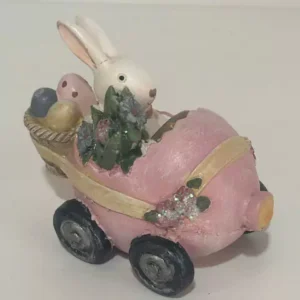 Coelho no carrinho rosa em resina 8x10x6cm