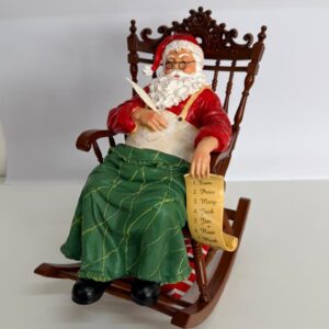 Noel na cadeira balanço com mov e som 27cm